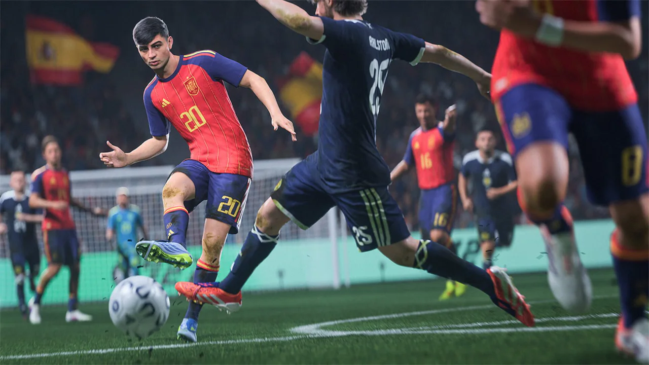 Un futbolista de EA Sports FC 27, vestido con la camiseta roja y azul número 20, está a punto de golpear el balón en pleno partido, con un defensor del equipo rival con el dorsal 25 en la camiseta azul oscura intentando interceptar la jugada. La imagen resalta la acción dinámica del gameplay.