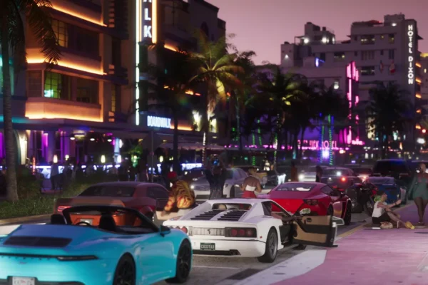 Escena nocturna del tráiler de GTA 6 en Vice City con coches deportivos de lujo aparcados frente a hoteles iluminados por luces de neón.