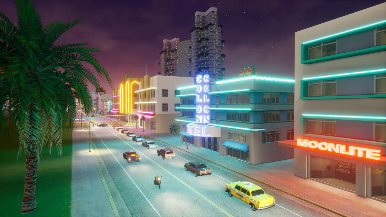 Vista nocturna de una avenida en Vice City con edificios iluminados con letreros de neón como el Collins Hotel y Moonlite, representando el entorno de GTA VI.