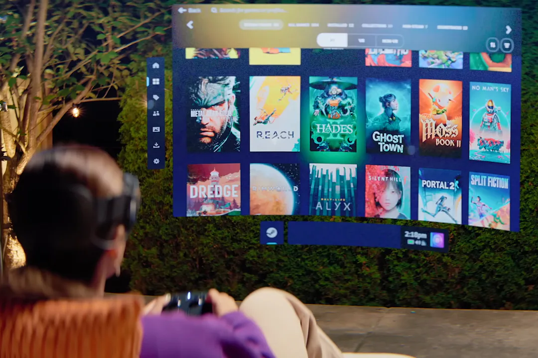 A user experiencing the Steam Frame interface on a large virtual screen while wearing a VR headset in an outdoor setting, showcasing the device's immersive capabilities.