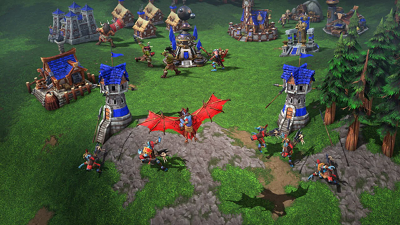 Vista aérea de una base humana y unidades de combate en Warcraft III: Reforged, mostrando el estilo visual actualizado del juego.
