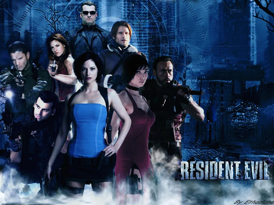 The main cast of the Resident Evil film adaptation stands together in a promotional group photo against a moody, futuristic backdrop.